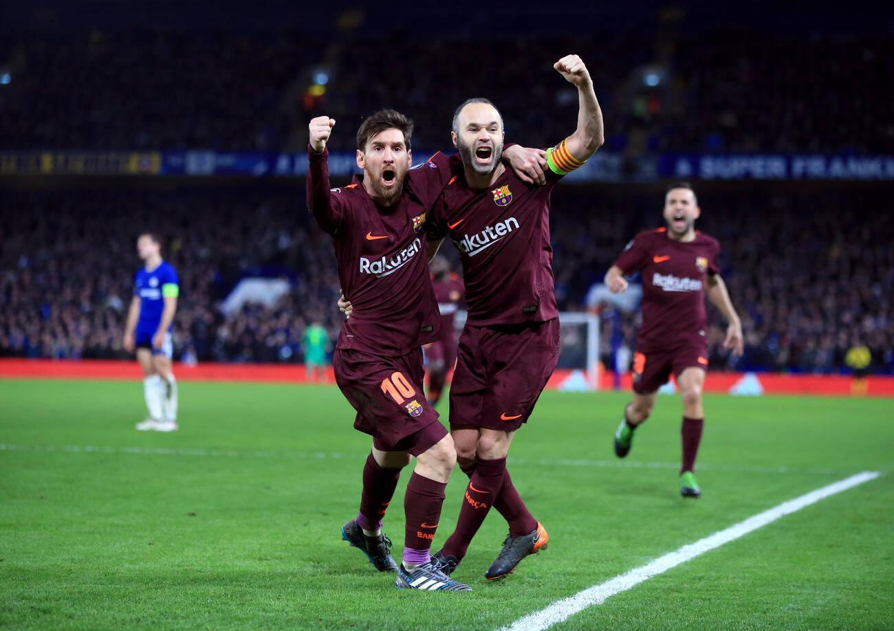 Barcelona's Lionel Messi (left) celebrates scoring his side's first goal of the game with Andres Iniesta during the UEFA Champions League