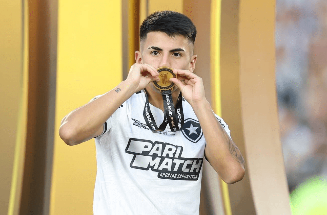 Buenos Aires, Argentina. 01st Dec, 2024. Thiago Almada of Botafogo kisses the medal during the Conmebol Libertadores 2024 final match between Clube Atletico Mineiro and Botafogo FR played at Monumental Stadium on November 30 in Buenos Aires. (Photo by Miguel Marruffo/PRESSINPHOTO) Credit: PRESSINPHOTO SPORTS AGENCY/Alamy Live News